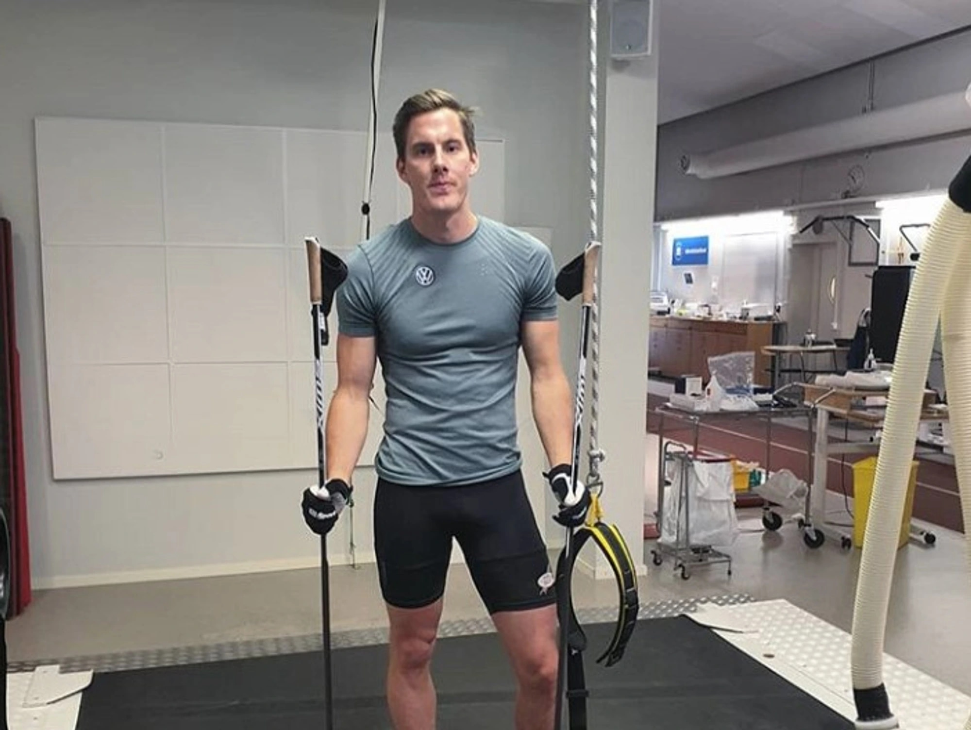 Training-clad male with ski poles
